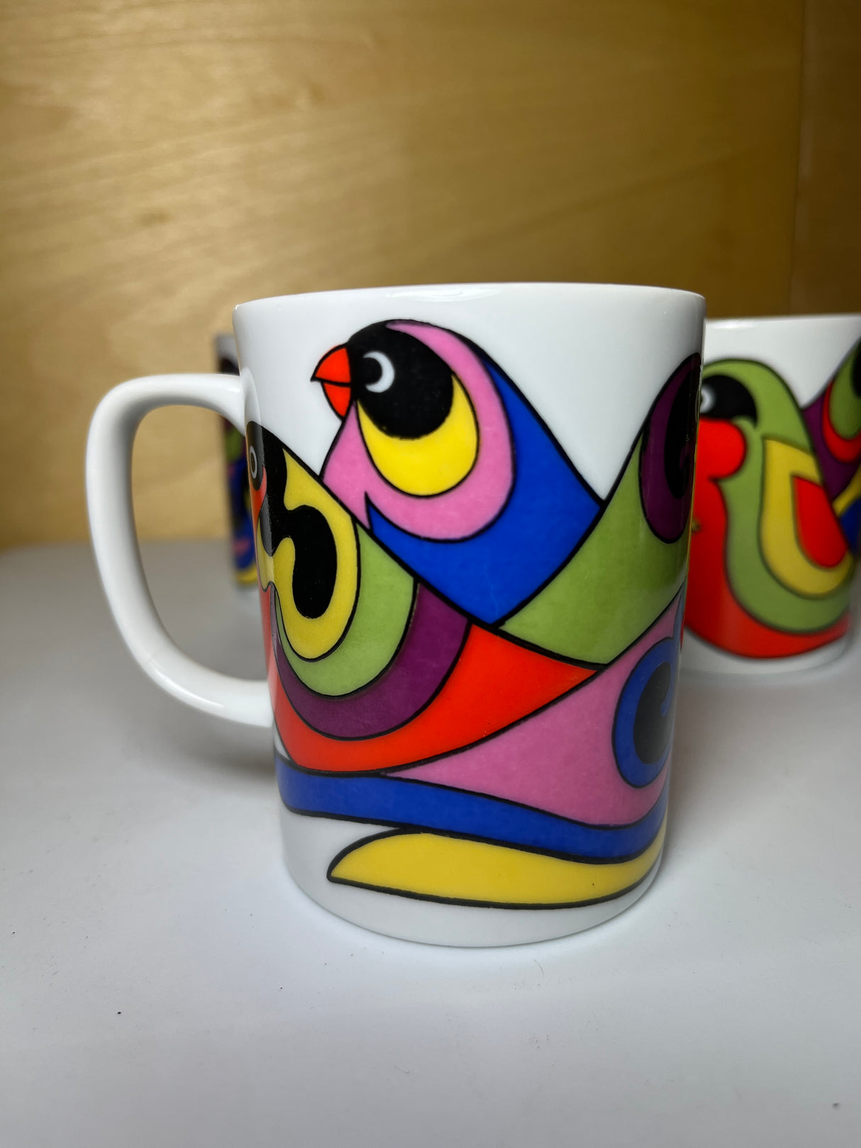 Set of four mugs featuring a groovy design with bird patterns, capturing the essence of the FF collection.
