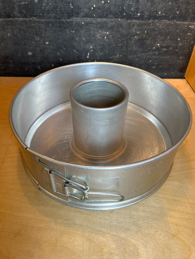 Springform 3-piece angel food cake pan - vintage Manitowoc aluminum, featuring a removable base and side spring-clip latch, ideal for airy cakes with central tube support.