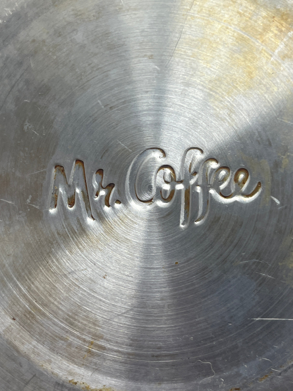 Close-up of Mr. Coffee stainless steel 1.75-quart tea kettle, showcasing its metal surface and spout.