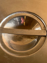 Close-up of a vintage Vollrath 18-8 stainless steel 8.5-quart soup chafing dish insert lid, featuring a pivoting bar-style handle stamped Vollrath Stainless Steel.