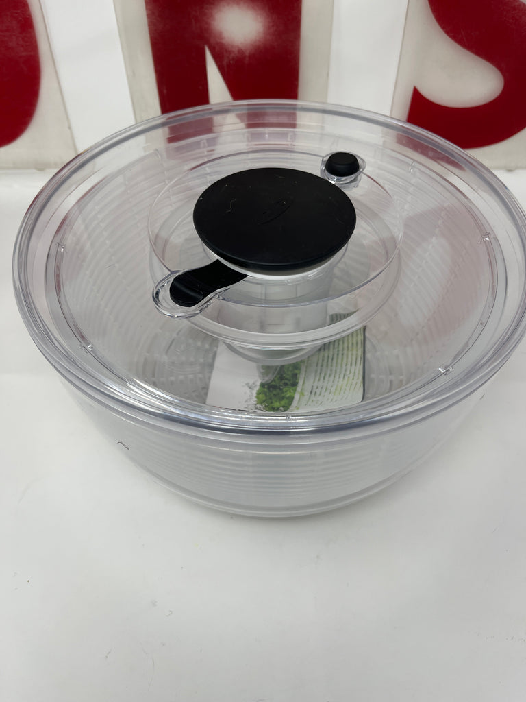 OXO Good Grips Large Salad Spinner featuring a clear container with a black lid, ideal for washing salad greens and delicate produce.