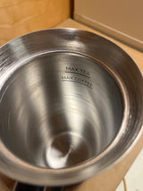 Espro stainless-steel beverage vessel interior showing etched fill-level markers labeled “MAX TEA,” “MAX COFFEE,” and “MIN” for precise drink preparation.