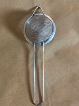 Stainless steel mesh strainer with loop handle, 2 inch, featuring a fine mesh, long handle, and hanging ear for easy steeping and storage.