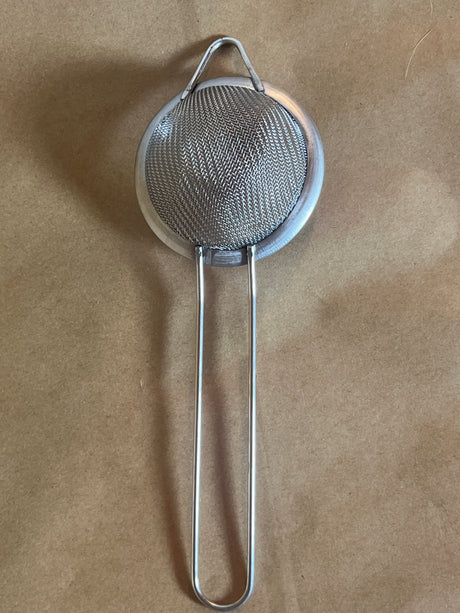 Stainless steel mesh strainer with loop handle, 2 inch, featuring a fine mesh, long handle, and hanging ear for easy steeping and storage.