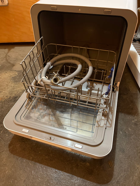 Farberware Professional Portable Dishwasher with built-in water tank, shown set up on a countertop, ideal for small kitchens, featuring five wash programs.