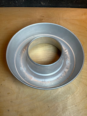 Vintage Circular Bundt pan in aluminum, featuring a round mold with a hollow center tube for even baking. Notable for its lightweight design and small dings.