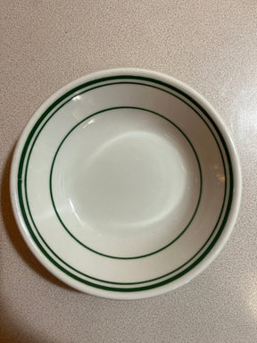 Homer Laughlin China set featuring plates, bowls, saucers, mugs, and a creamer, elegantly displayed to highlight their classic design and craftsmanship.