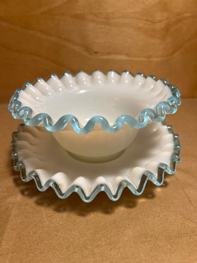 Bowl n plate set of ruffled-edge milk glass with crimped rims, featuring a small serving bowl and matching underplate, highlighted by translucent trim.