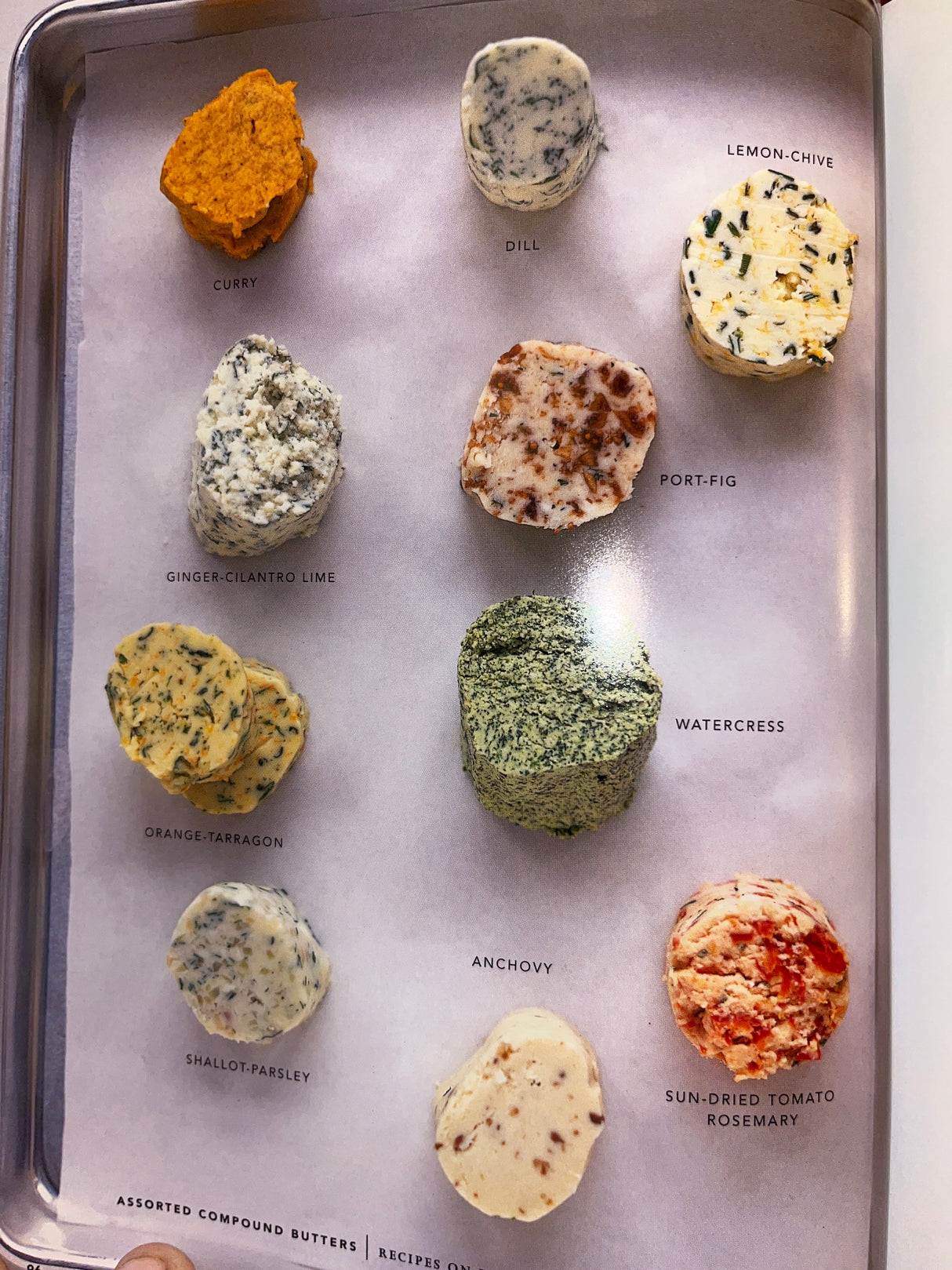 Martha Stewart’s agora D’oeuvres features a sheet-pan with ten assorted compound butter rounds, including flavors like Curry, Lemon-Chive, and Sun-Dried Tomato-Rosemary.