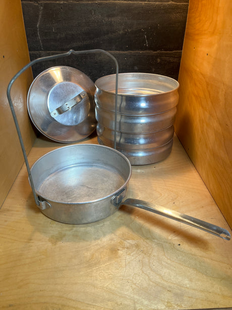 Stackable 5-tier food storage container - vintage aluminum Buckeye by Mardigian Corp., featuring nestable cookware with a long handle and folding wire bail, ideal for outdoor use.