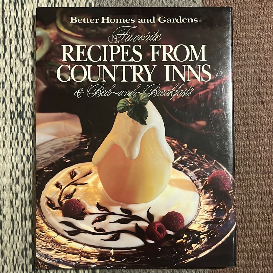 Better Homes and Gardens Recipes from Country Inns & Bed and Breakfasts book, displayed on a carpet, showcasing delicious inn-inspired dishes and captivating culinary photography.