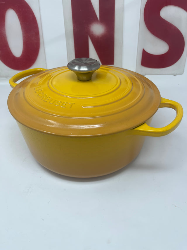 Yellow pot with lid, titled Untitled Feb5_18:47, suitable for cooking and serving, featuring sturdy handles and a sleek design.