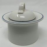 A white ceramic dish with lid, perfect for serving.