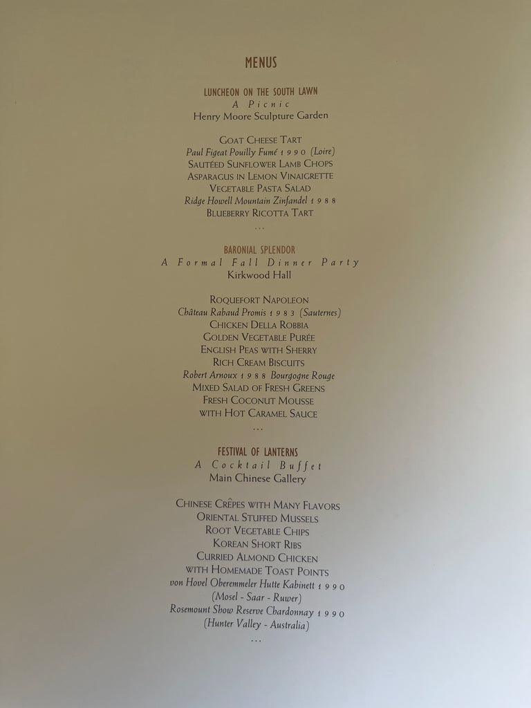 A menu featuring diverse recipes from the Nelson-Atkins Museum of Art cookbook, including Salmon-wrapped Asparagus, Duck with Raspberry Sauce, and Cranberry Nut Pudding.