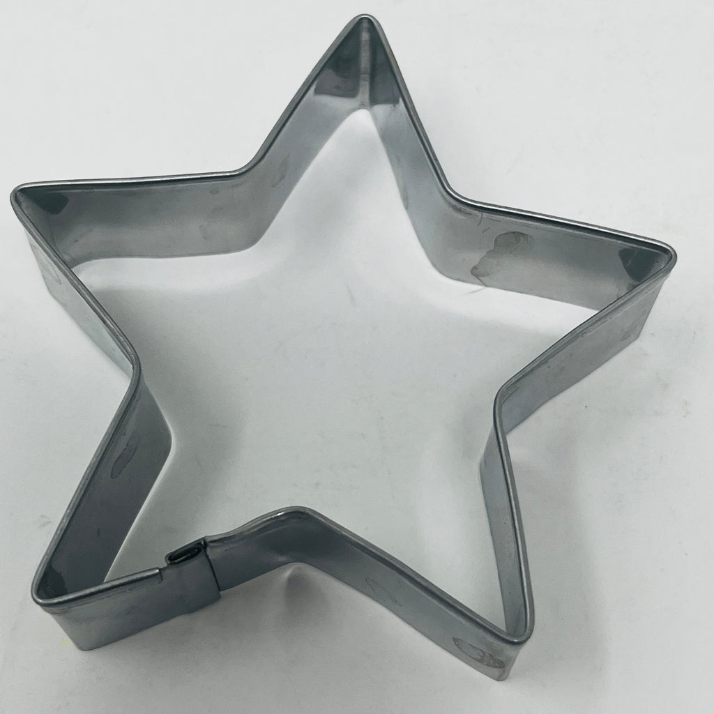 Mid century metal star shaped cookie cutter. From Spoons Kitchen Exchange. 