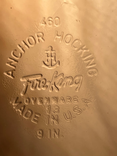 Embossed underside of a 9-inch vintage glass Fire-King Anchor Hocking 460 pie plate, featuring maker’s mark and “Made in U.S.A.” details.