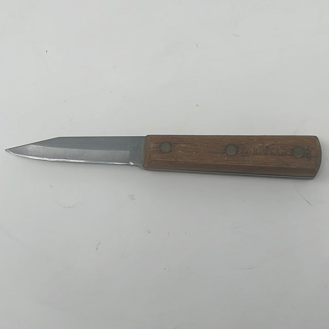 A robust Old Homestead parer knife with a thick blade, sharpened to a razor-thin edge. Visible wooden handle and metal blade.