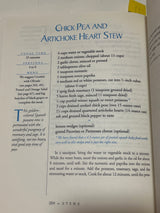 Cookbook page from Moosewood Restaurant Cooks at Home featuring a Chick Pea and Artichoke Heart Stew recipe with ingredients and cooking instructions on page 204.