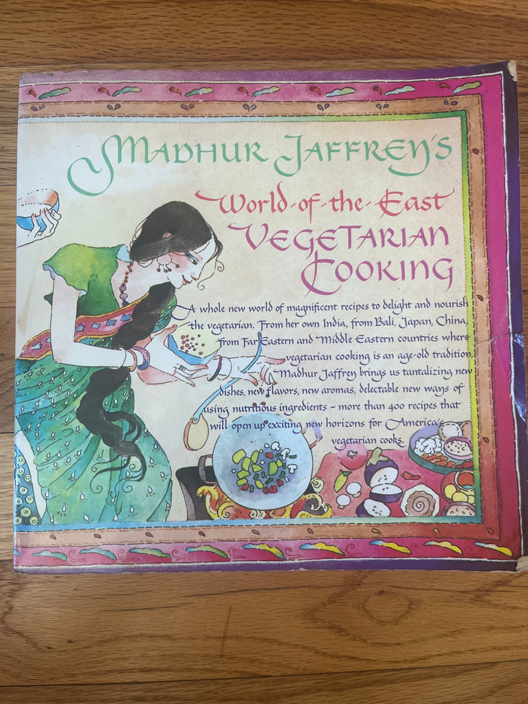 Madhur Jaffrey's World-Of-The-East Vegetarian Cooking cookbook displayed on a table.