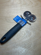 Dual pastry cutter with soft grip black handle from Crofton, featuring smooth and fluted wheels for versatile cutting of pastry, ravioli, and pizza.