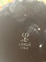 Maker’s mark on the bottom of a Lenox porcelain dish, showcasing the stylized “L” logo over “LENOX USA,” representing the vintage Lenox Nutmeg line water goblets.