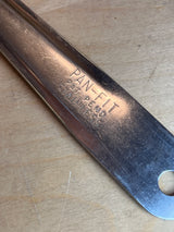 Blunt end serving spoon - Pan-Fit stainless steel shown on wood, highlighting its sturdy design and large bowl, perfect for serving hearty dishes.