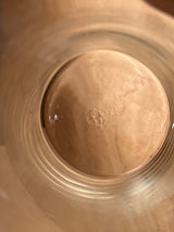 Top-down view of Libbey tall apothecary jar, showing concentric glass rings on a wooden surface, highlighting its clear, cylindrical design.