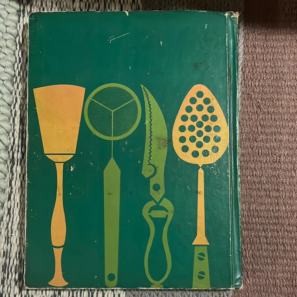 The Professional Chef textbook with detailed culinary techniques and international cuisine recipes. Back Cover featuring illustrations of cooking tools in lime green and mango yellow against a dark green background. From Spoons Kitchen Exchange.