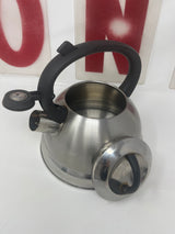 Mr. Coffee stainless steel 1.75-quart tea kettle with handle, visible whistling spout, and minor surface wear.