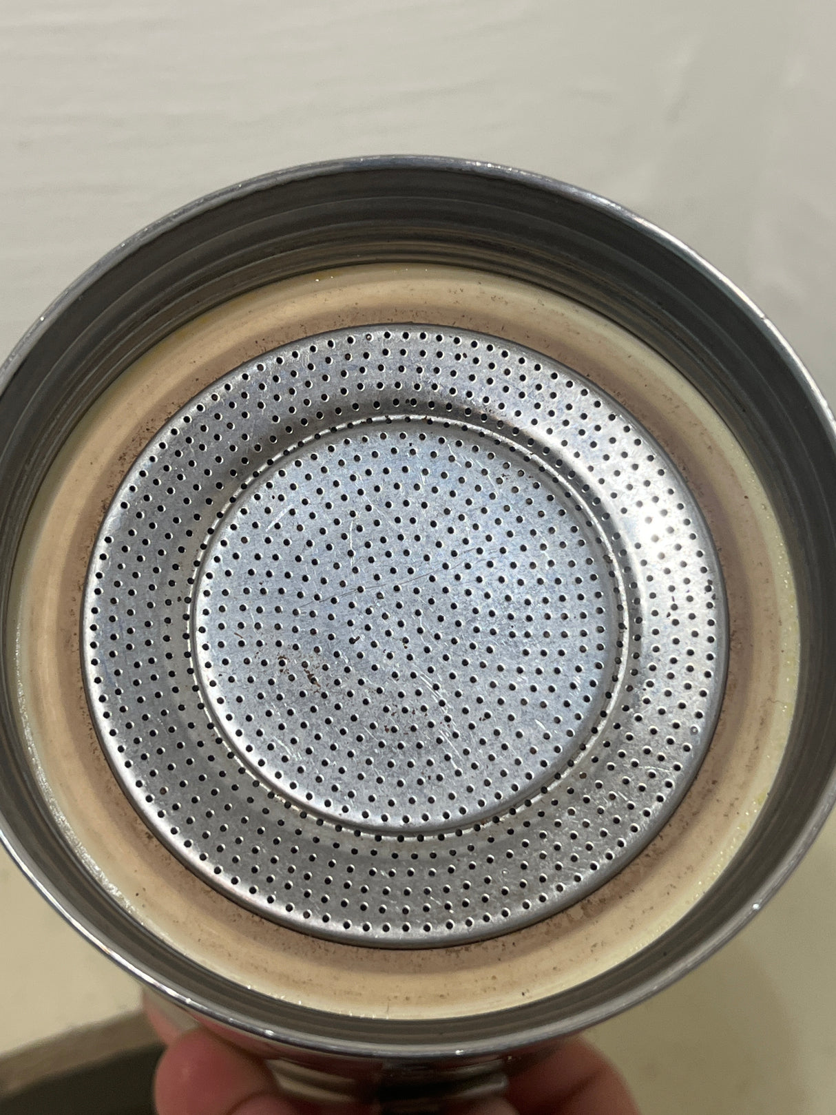 Ilsa Turbo Express 6-Cup 18/10 stainless steel stovetop espresso pot with a stainless-steel filter plate and rubber gasket, showcasing its durable and elegant design.