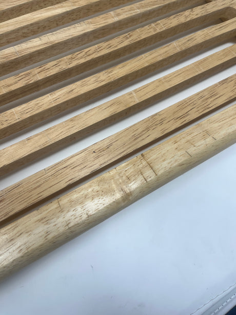 Close-up of a Bamboo Bread Board, showcasing its wooden slat design and sturdy build, ideal for slicing bread with antibacterial bamboo and easy-to-clean plastic base.