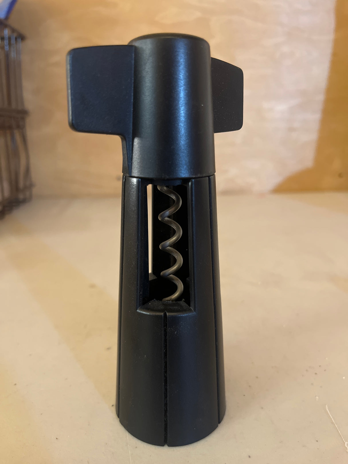 Wine bottle opener from The Pampered Chef, featuring a sleek design with a sturdy handle and corkscrew, ideal for easily uncorking wine bottles.