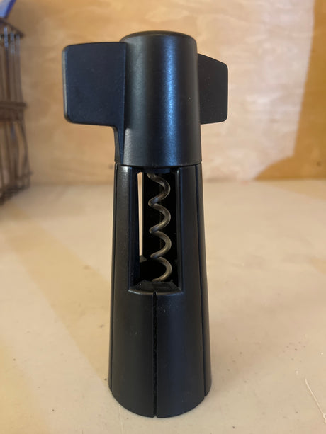 Wine bottle opener from The Pampered Chef, featuring a sleek design with a sturdy handle and corkscrew, ideal for easily uncorking wine bottles.