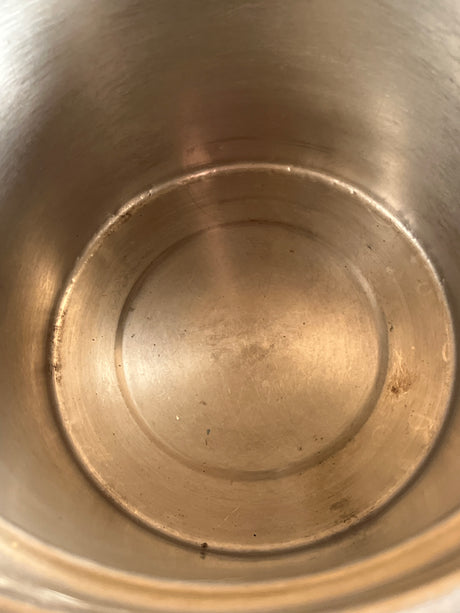 Inside view of a vintage Vollrath 18-8 stainless steel soup chafing dish insert, 8.5 quart capacity, showcasing the smooth metal interior and base.