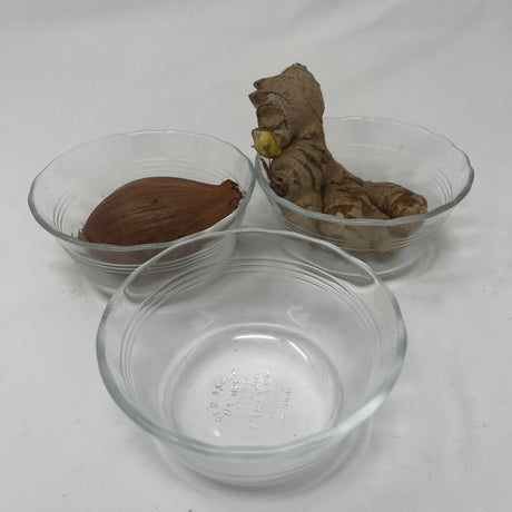 Corning PYREX small dishes with food in glass bowls, ginger root, and wood object.