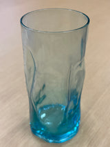 Close-up of a Bormili highball glass, showcasing its sleek, transparent design and smooth contours, ideal for serving beverages stylishly.