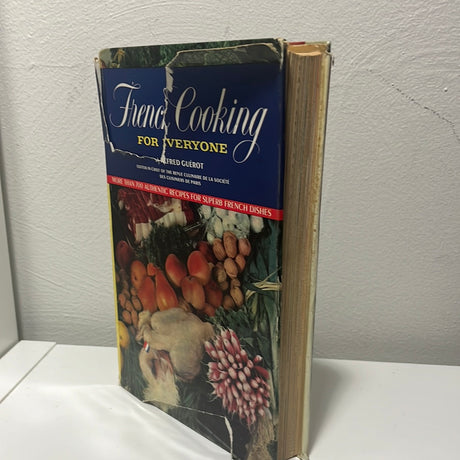 Cover of French Cooking for Everyone featuring an illustration of radishes, highlighting French cuisine with over 700 recipes and colorful photographs.