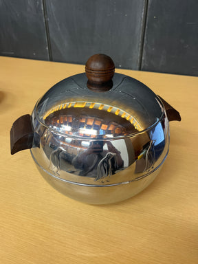 1950s West Bend Penguin steel hot and cold server set with Bakelite handles, featuring an embossed penguin motif, suitable for serving or storing ice or hot food.