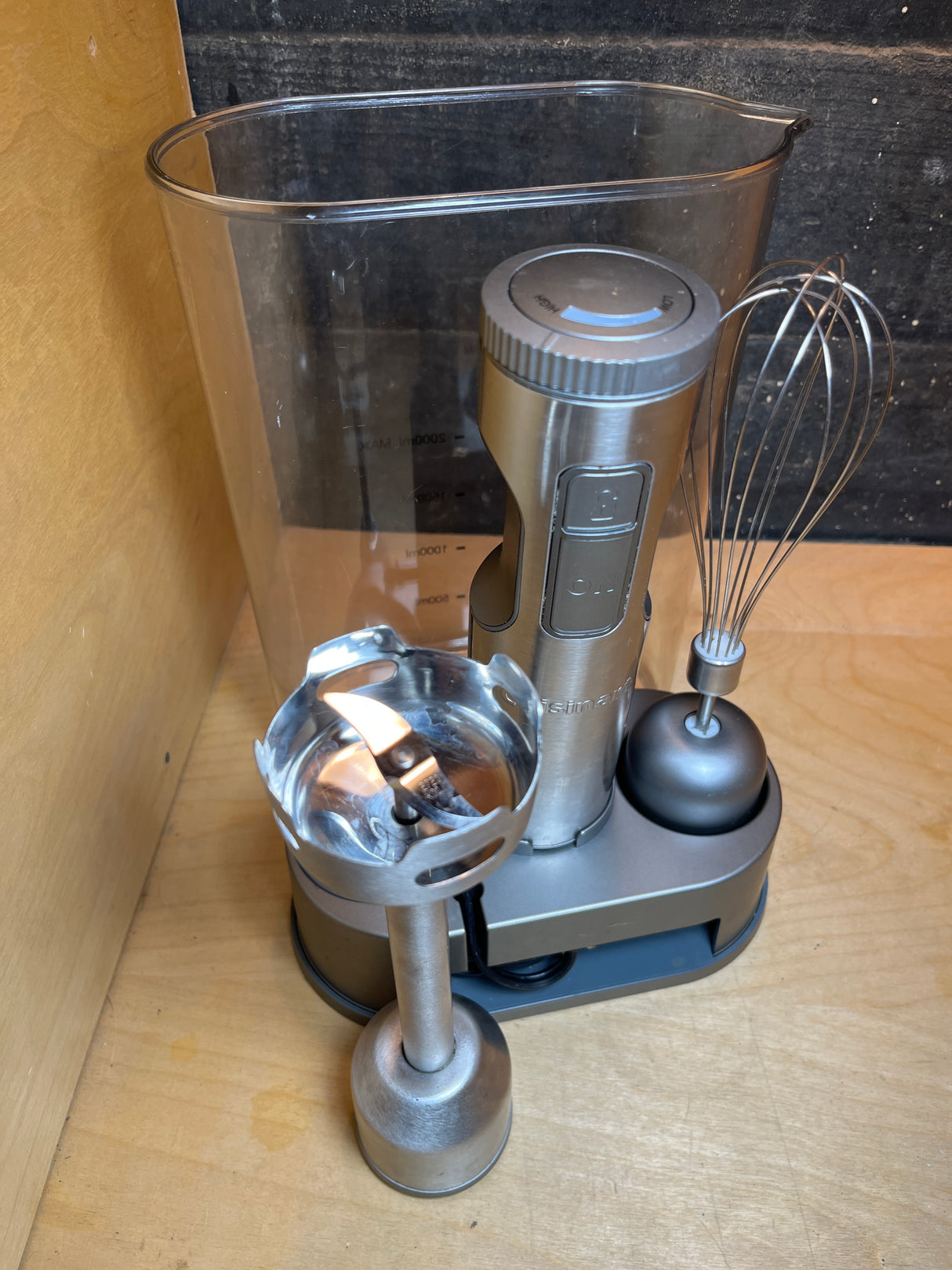 Cuisinart stick blender and whisk set HB-800PC, featuring a cordless motor unit, stainless steel blender, whisk attachment, mixing beaker, and compact charging stand.