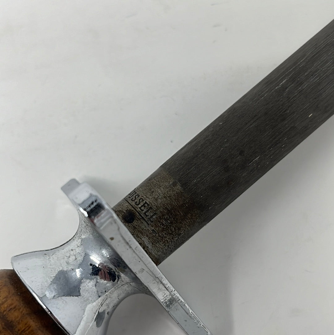 Dexter 1227-12 Butcher Carbon Steel Honing Rod with Hardwood Handle, a close-up that shows the Russell logo. From Spoons Kitchen Exchange.