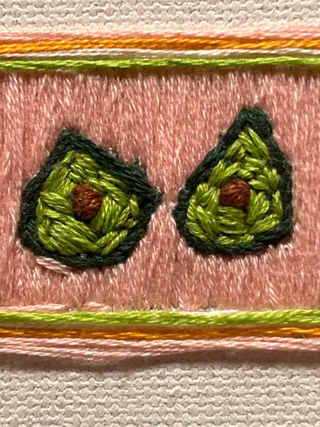 “Avocado Slice” (2026) - embroidery on canvas - Vibrantly Earthy