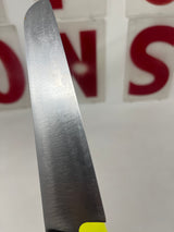 Vintage santoku chef’s knife with a 5.75” steel blade and wood handle, showcasing expert precision and a small chip on the handle for character.