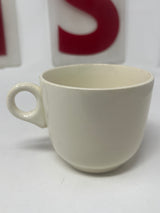 Antique Scio restaurantware ironstone coffee cup with visible handle, showcasing vintage charm and minor rim and base chips, reflecting 1940s craftsmanship.