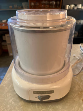 Automatic ice cream maker - Hamilton Beach 68880 with branded base, on/off switch, frozen-insulated bowl, and clear lid, for quick homemade frozen desserts.