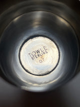 Towle sterling silver jigger shot glass with a sleek midcentury design, featuring minor dents on the edges, perfect for enhancing your bar cart's elegance.