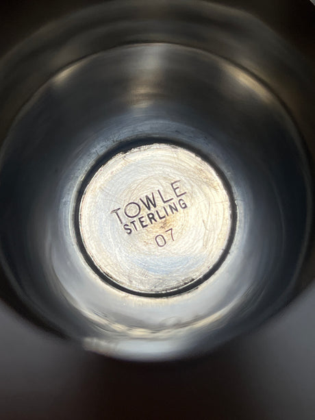 Towle sterling silver jigger shot glass with a sleek midcentury design, featuring minor dents on the edges, perfect for enhancing your bar cart's elegance.