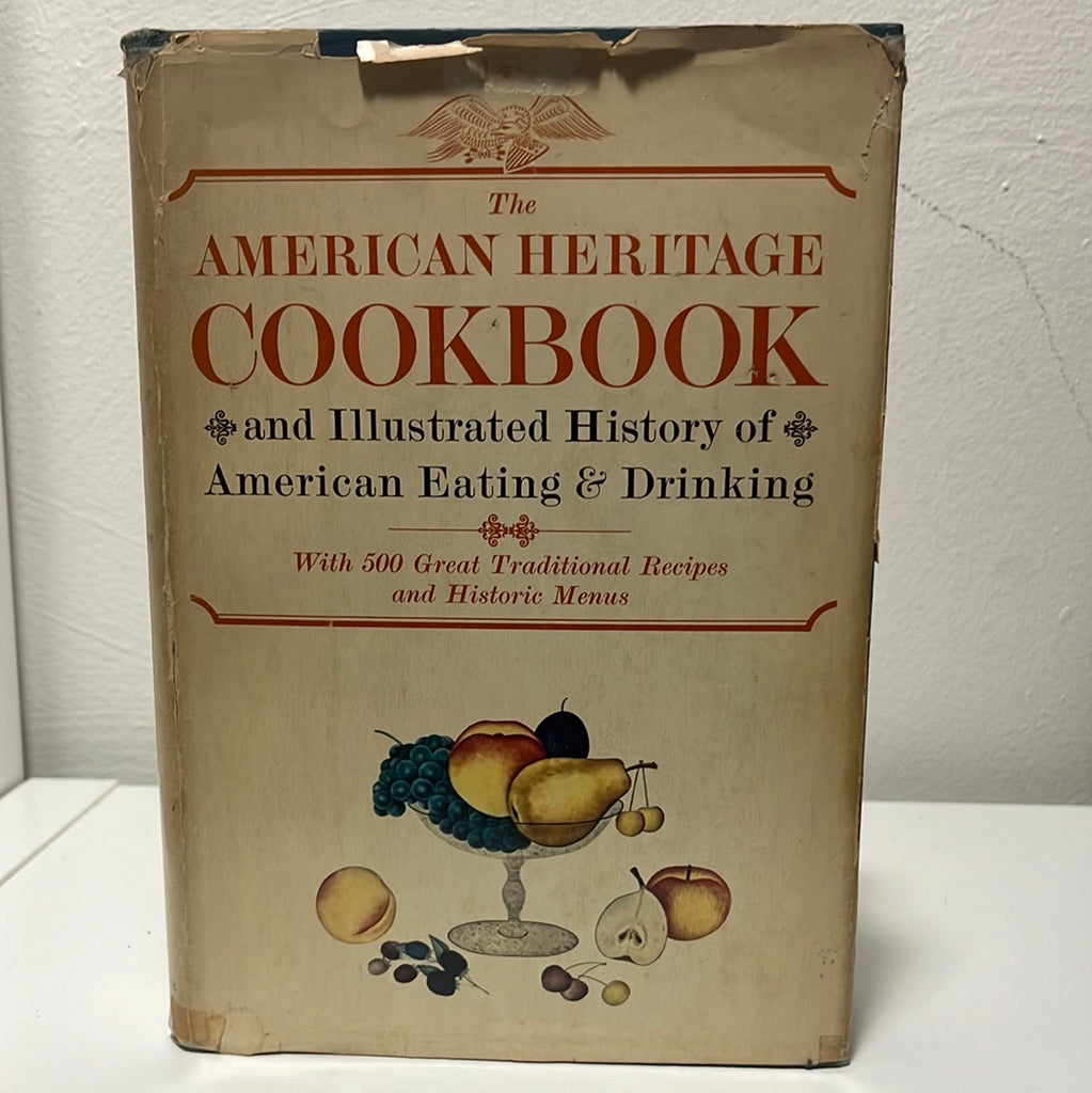The American Heritage Cookbook and Illustrated History of American Eating & Drinking front cover featuring a painting of fruit in a glass dish. From Spoons Kitchen Exchange.