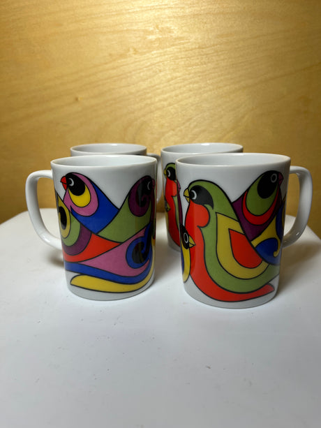 Set of four FF groovy mugs featuring a vibrant bird pattern, showcasing unique designs and artistic flair, perfect for adding charm to any kitchen collection.