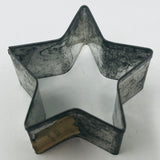 Mid century metal star shaped cookie cutter with adaptive design for easy grip.