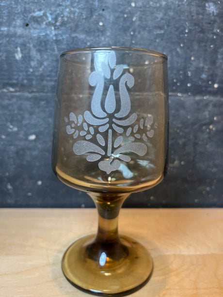 Set of 8 smokey wine glasses with etched floral motif by Pfaltzgraff, featuring amber-tinted glass and a frosted damask-style design on the bowl.